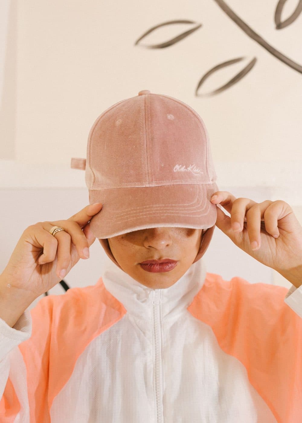 Pink baseball cap on a light studio background