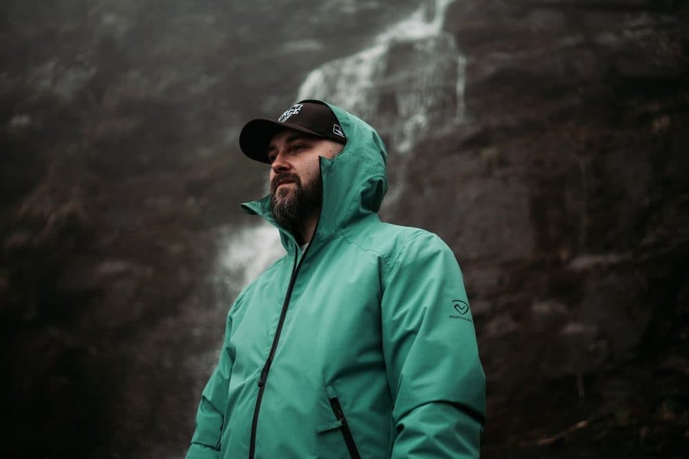 Green hooded outdoor shell jacket