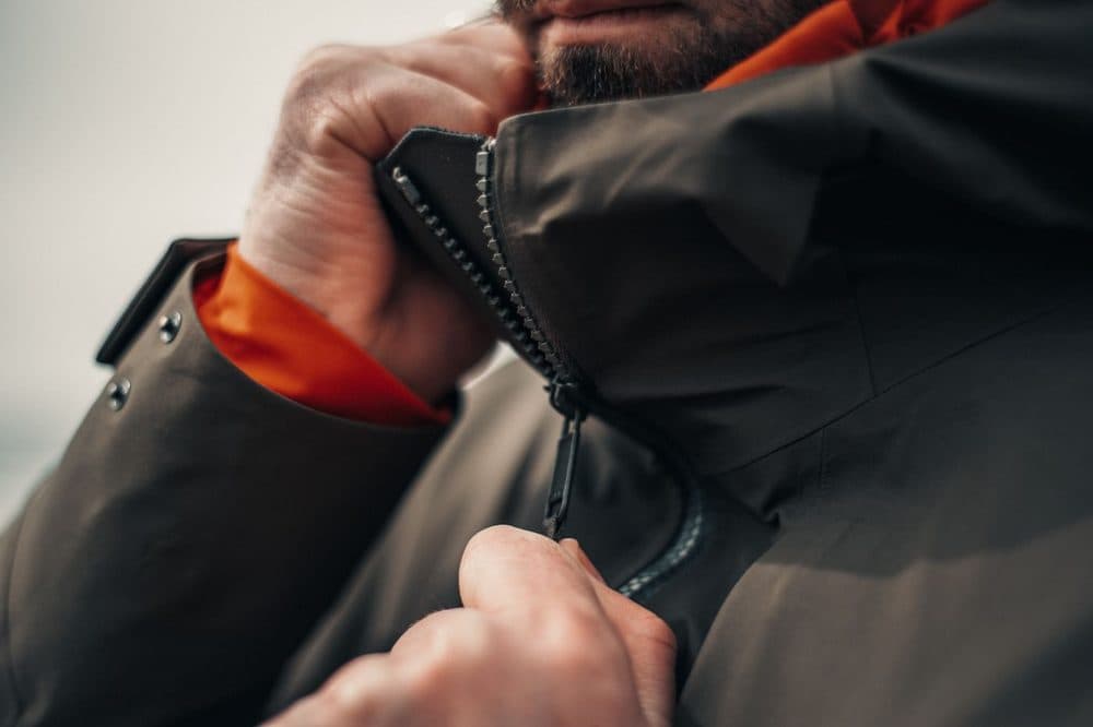 Close-up of a black jacket zip with contrast lining