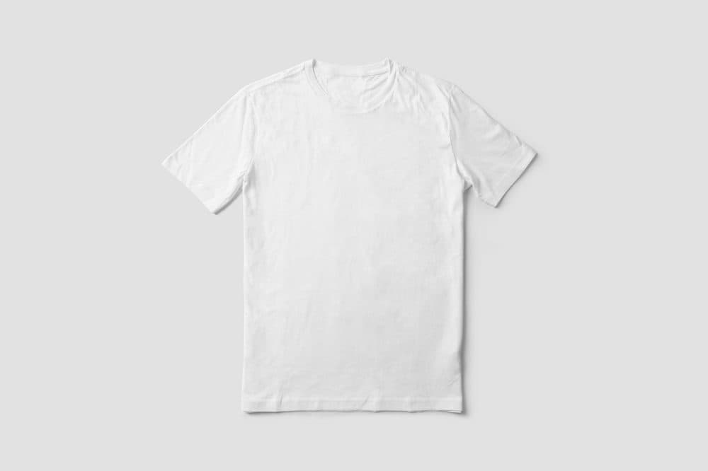 White t-shirt laid flat on a light grey background