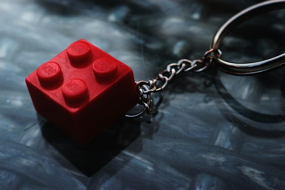 Red keychain with a metal ring and chain